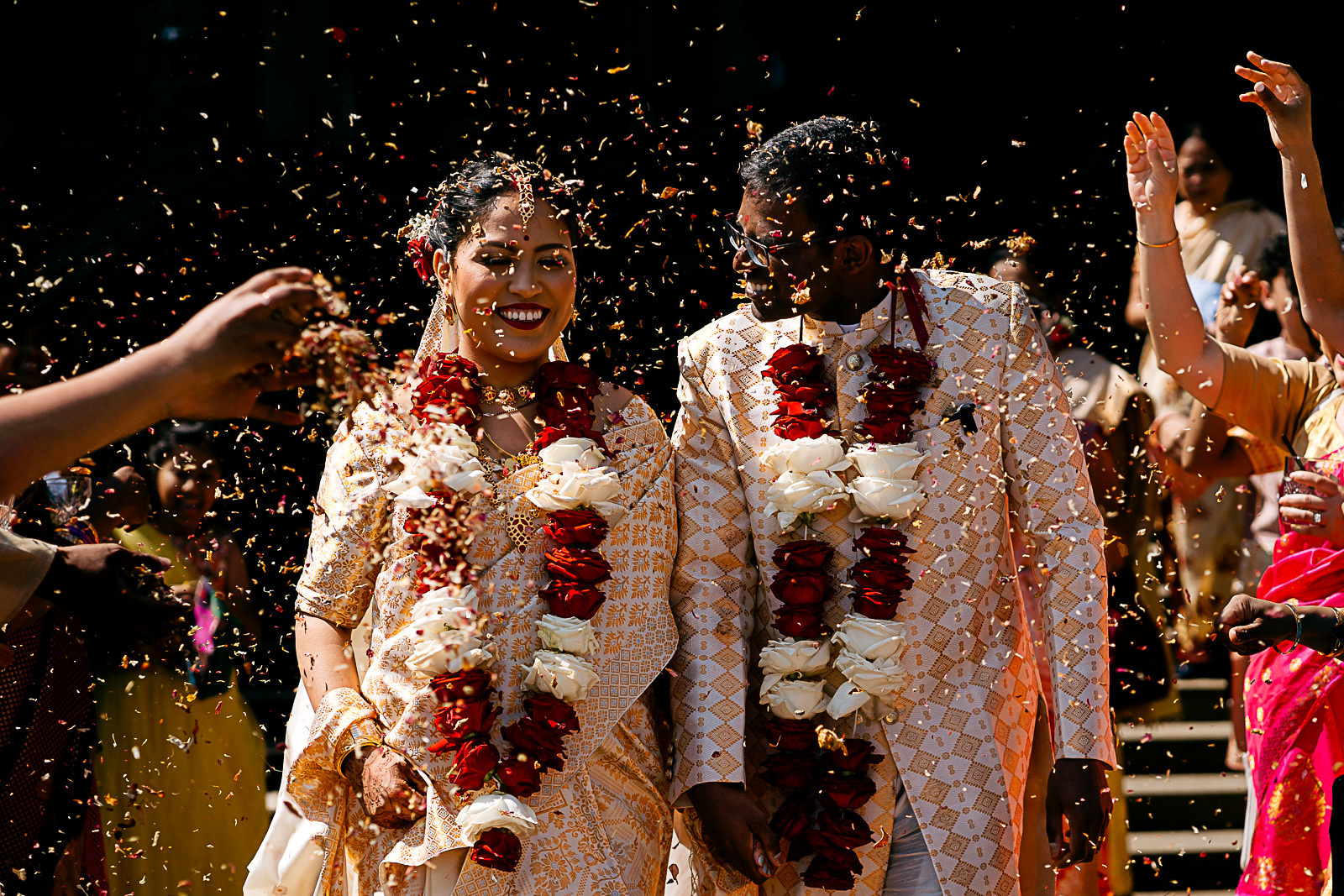 Bride and groom covered in confetti at carlton towers