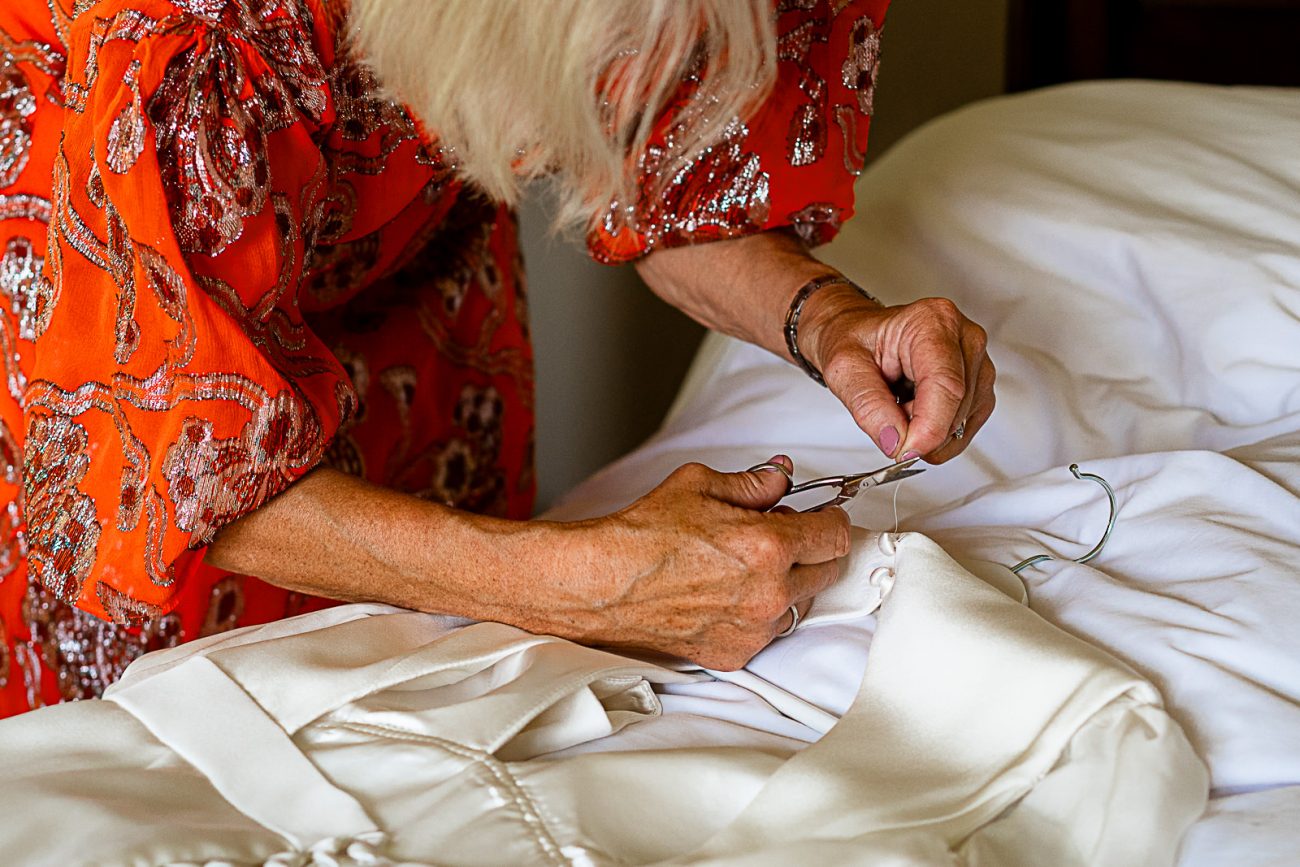 Mother of the bride fixing dress