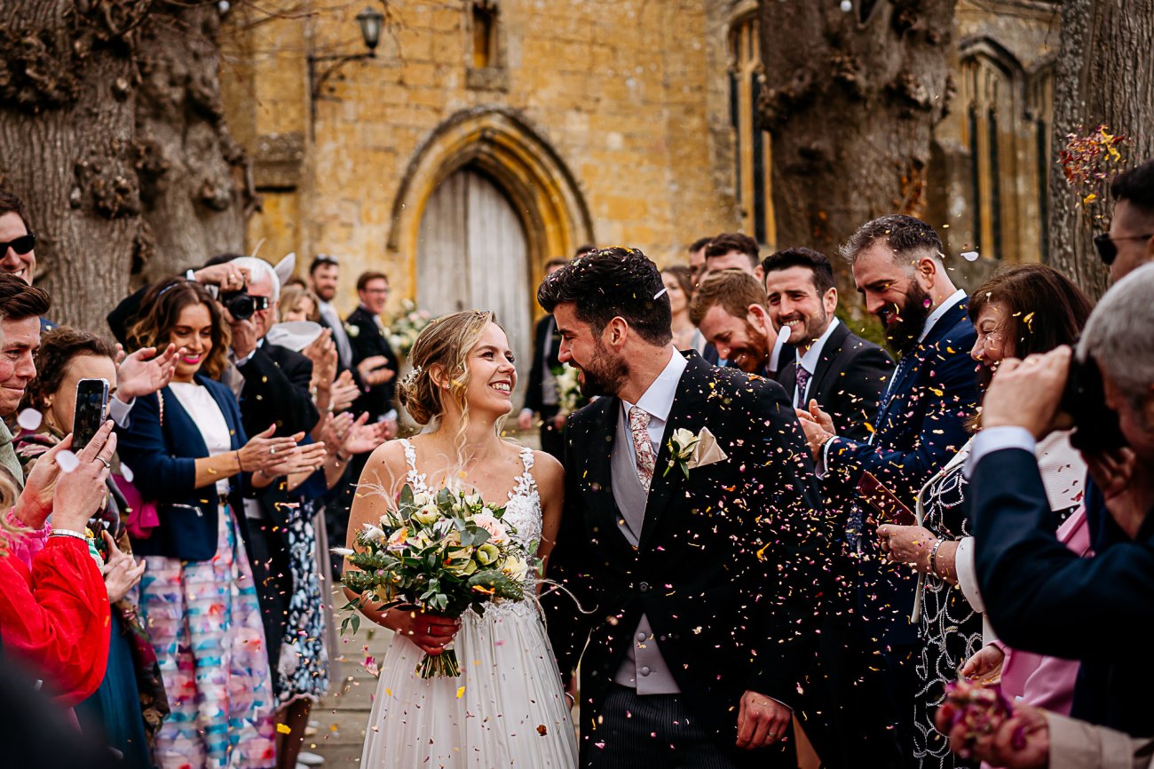 Confetti at church cotswolds wedding