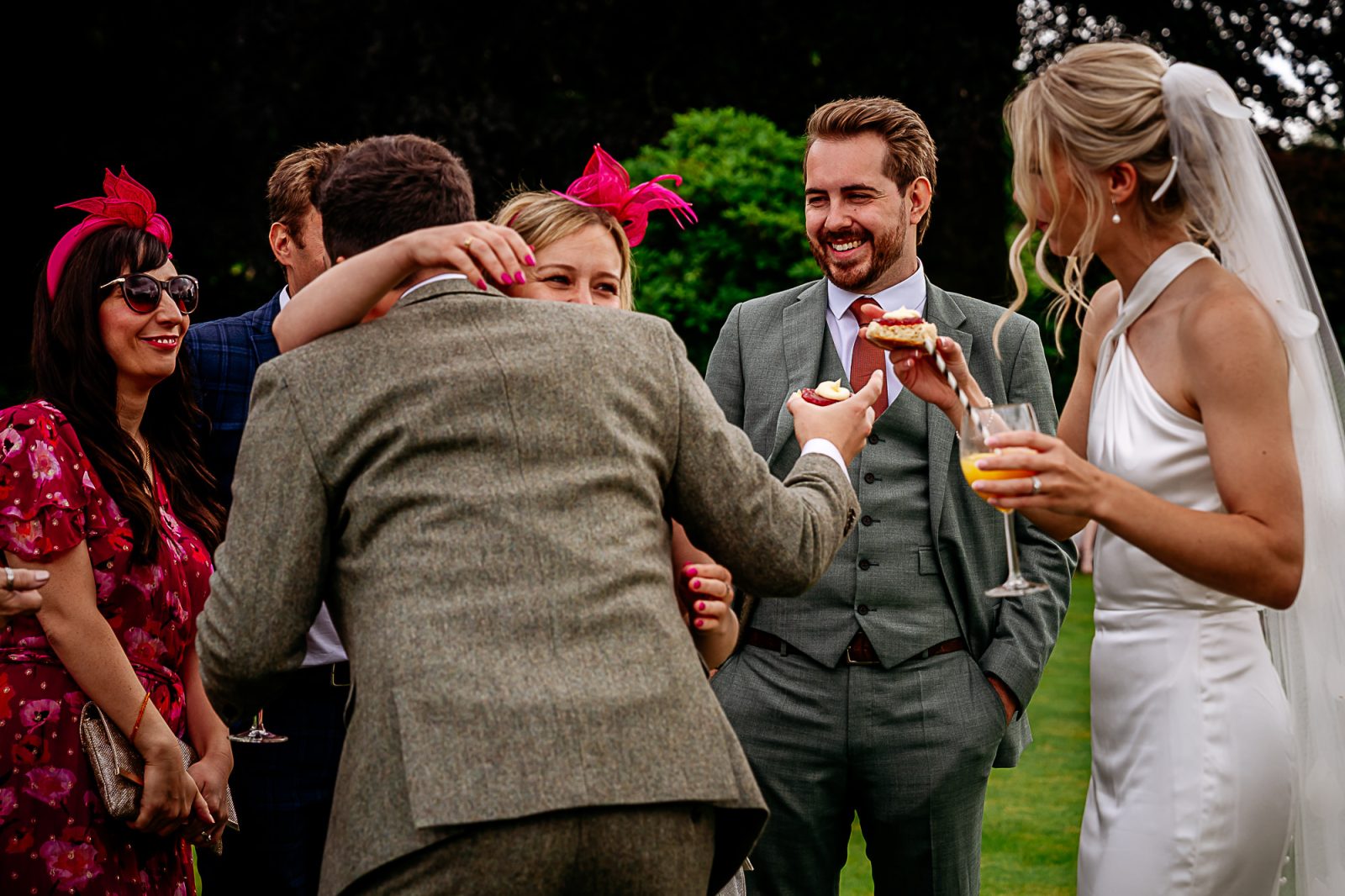 wedding guests and bride eating scone at Fairbank wedding farm