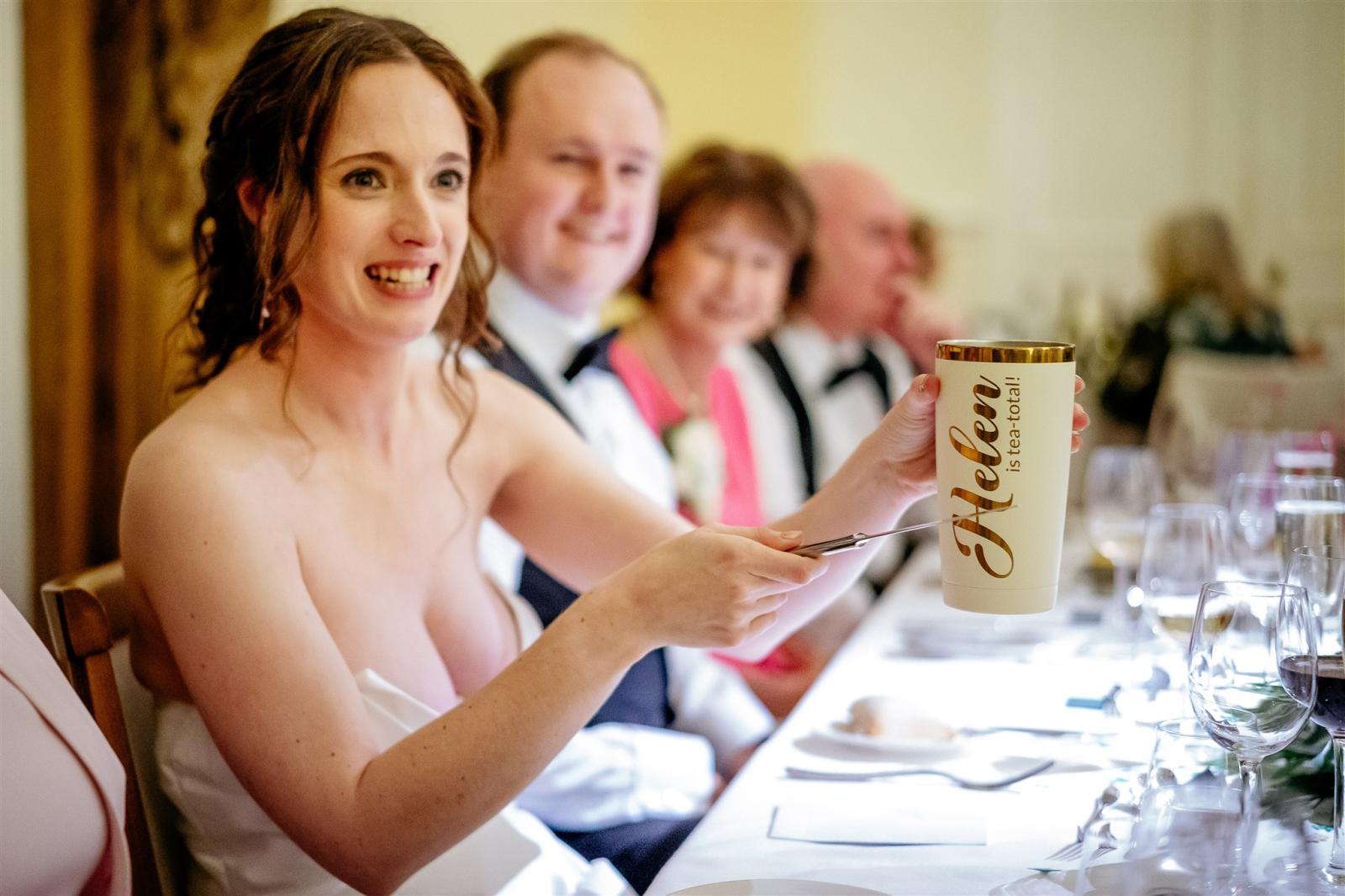 bride tapping her tea cup