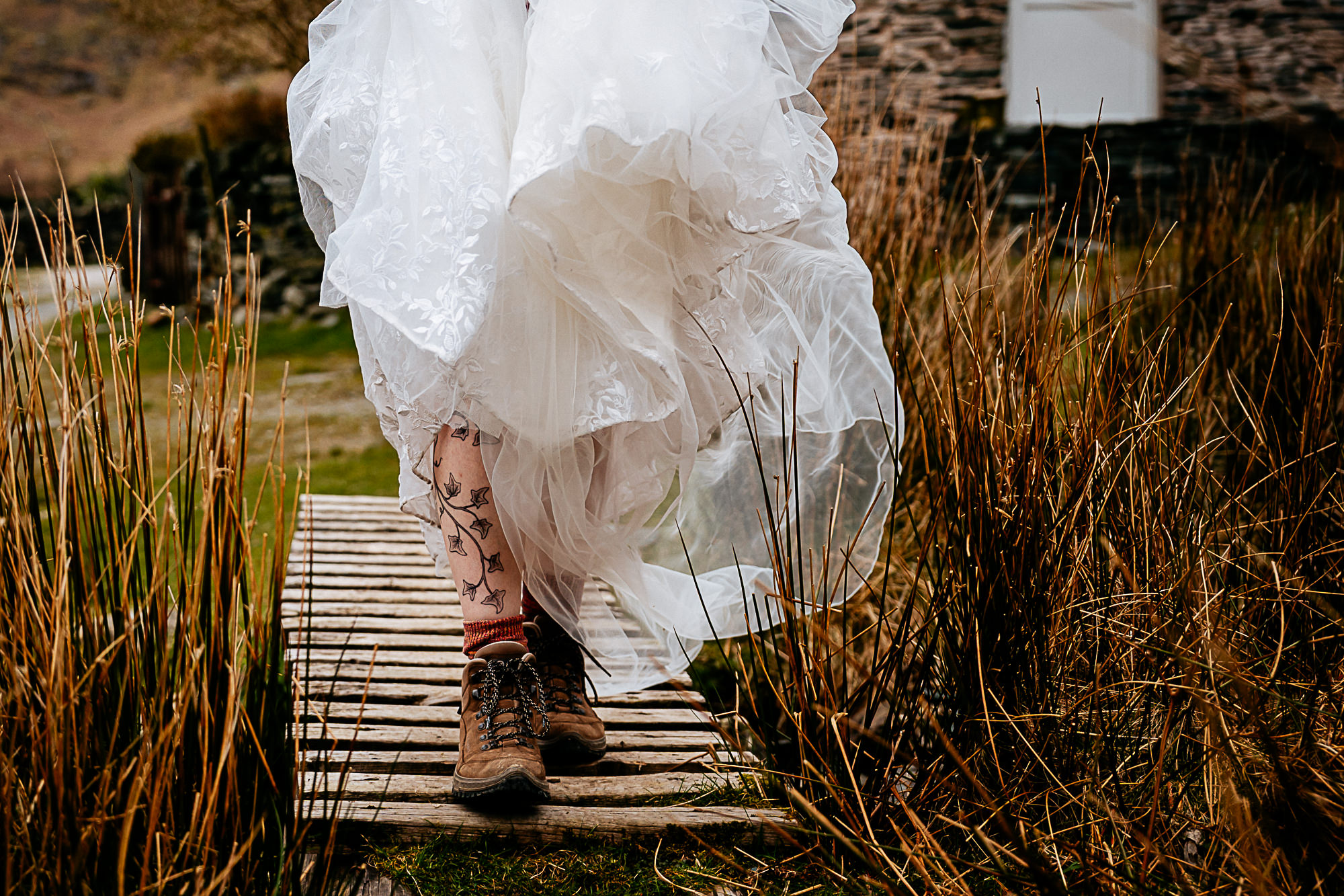 Non traditional wedding in lakes, tattoo and boots