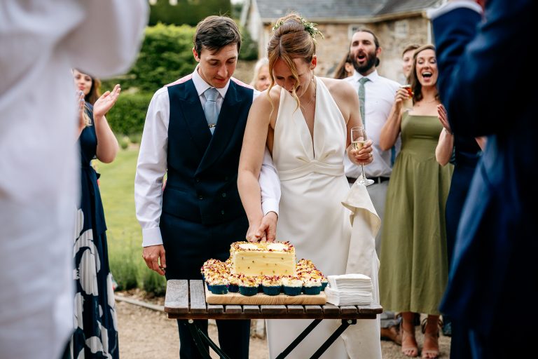 wedding cake cutting at Courtyard Venue